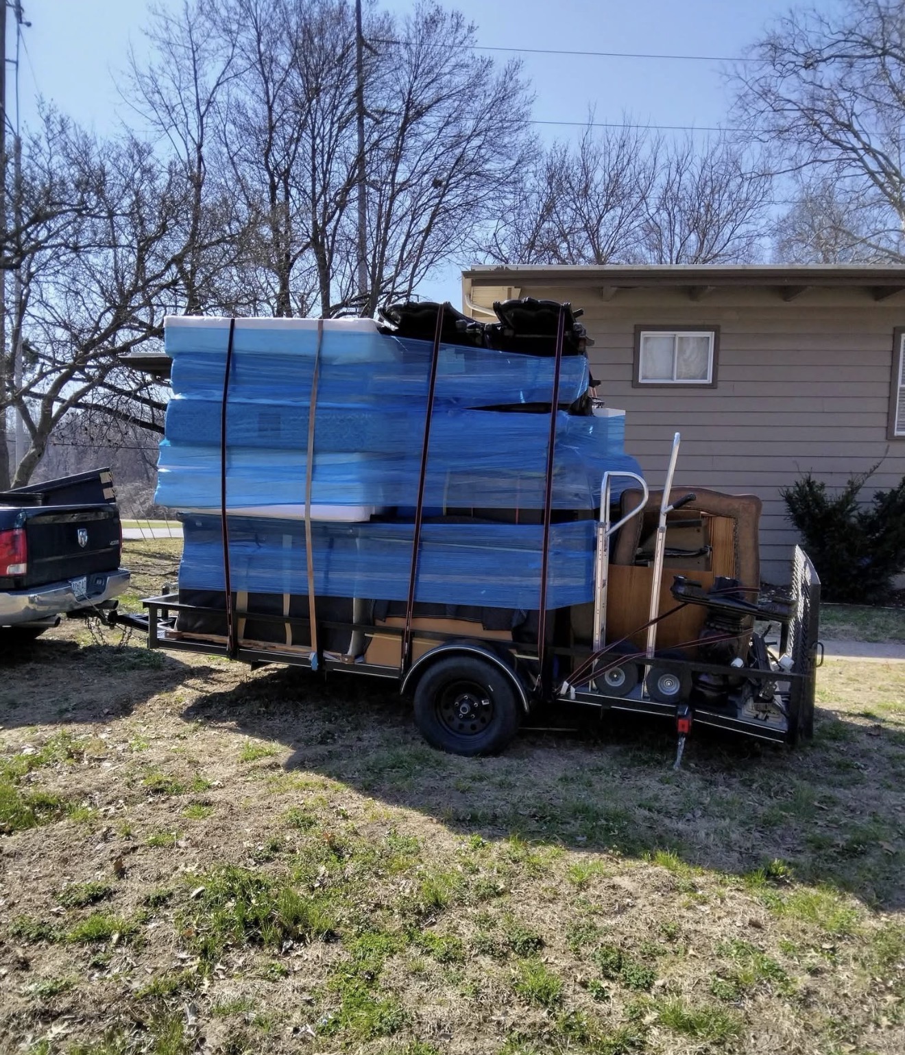 Mattresses and furniture wrapped on trailer