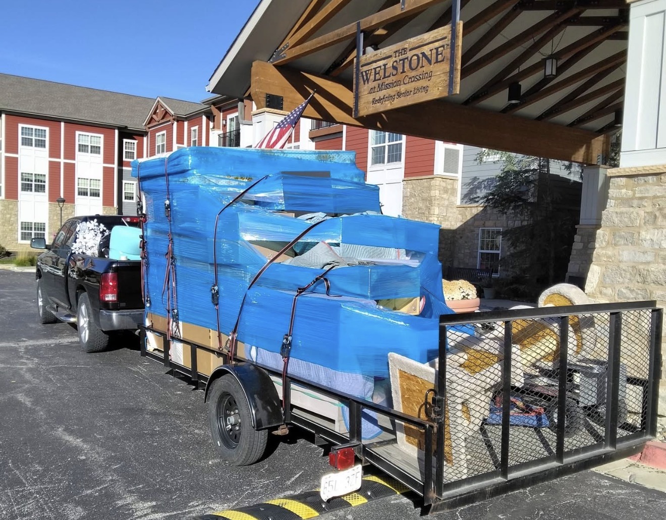 Story Moving & Packing fully loaded trailer at delivery site